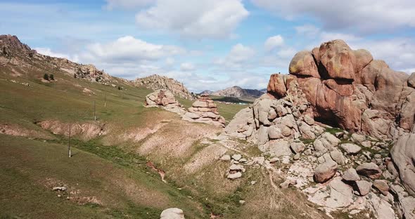 Terelj Park Rocks and Steppe Near Ulaanbaatar Mongolia. Summer Autumn Sunny Blue Sky Clouds