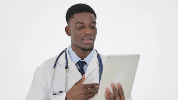 Video Chat on Tablet By African Doctor on White Background