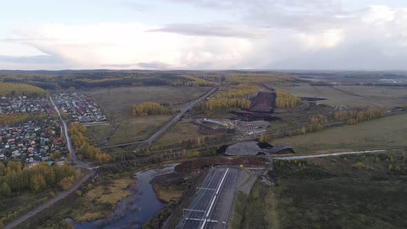 Highway. The asphalted section and the road section under construction 15