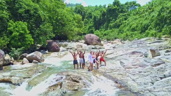 Camera Removes From Asian Children Standing in Stream