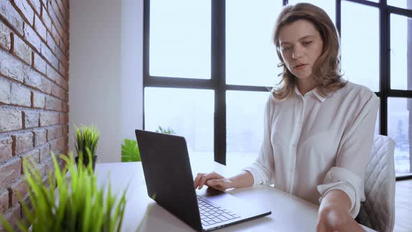 Businesswoman at Modern Workspace