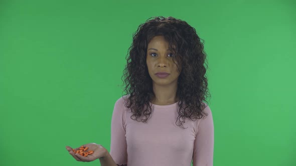 Portrait of Beautiful African American Young Woman Is Looking at Camera and Negatively Waving His