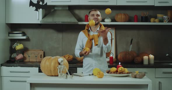 Juggling Man with Oranges Befor a Halloween Party