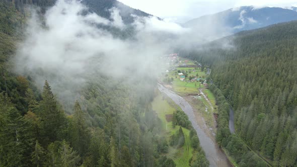 Mountains in Fog Slow Motion. Aerial View of the Carpathian Mountains in Autumn. Ukraine