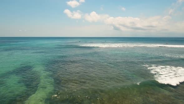 Aerial View Surfers on the waves.Bali,Indonesia