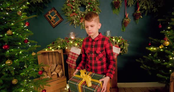 Boy is disappointed about his Christmas present and throws it to the ground