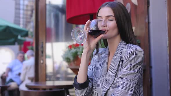 Woman Drinking Red Wine At Restaurant, Waiter Serving Food