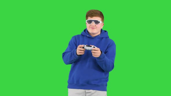 Cool Modern Kid Playing Video Game in Sunglasses on a Green Screen Chroma Key