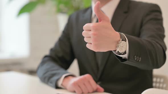 Close Up of Hand Gesture of Middle Aged Man Showing Thumbs Up Sign