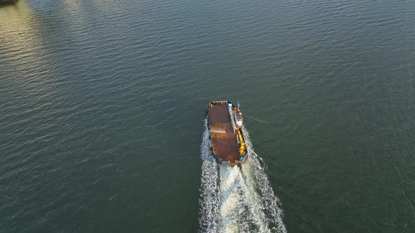 A Small Commercial Ferry Motoring at Sea