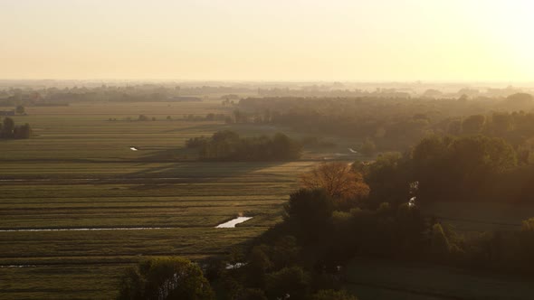 Beautiful sunrise aerial over farmlands Krimpenerwaard, Netherlands.