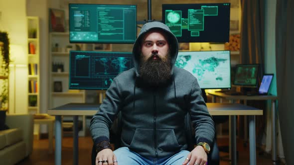 Bearded Hacker Wearing a Hoodie Using Augmented Technology