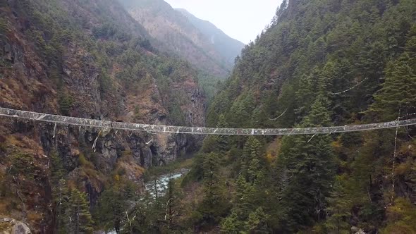 Suspension Bridge In Canyon. Nepal. Aerial Footage