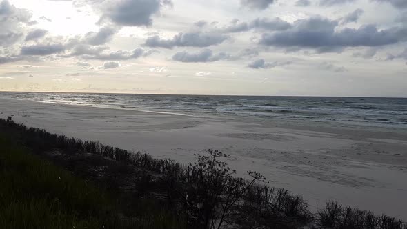 Windy day at the beach. Beautiful clouds. Pan shot. Lubiatowo, Poland.