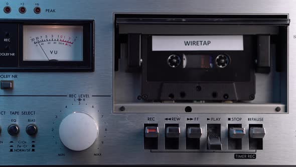 Vintage Audio Cassette Tape With Wiretap Recording Rolling in Deck Player