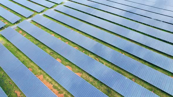 Drone fly over solar farm, renewable energy from solar.