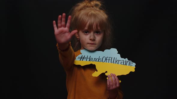 Portrait of Ukrainian Girl Child with Massage Inscription Text on Map Hands Off Ukraine Crisis War