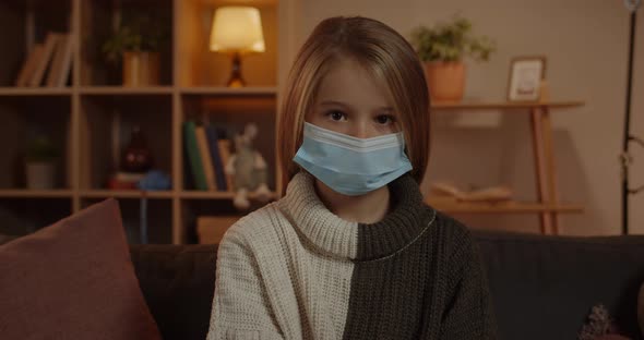 Crop View of Beautiful School Girl in Medical Protective Mask Looking to Camera