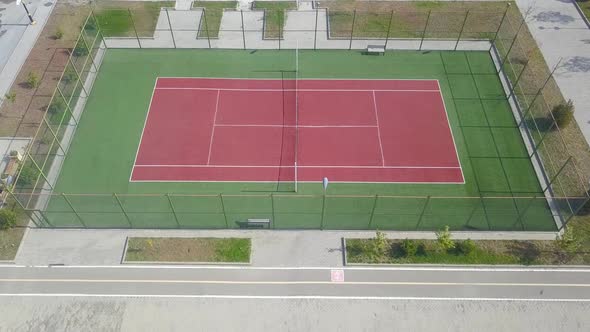 The goal of tennis is to hit the ball over the net into the other player's court.When the other play