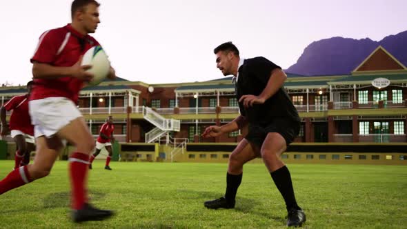 Male rugby players playing rugby in the stadium 4k