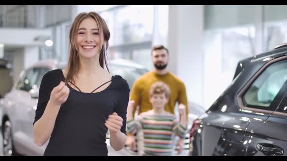 Young Beautiful Caucasian Woman Bragging Car Keys and Smiling