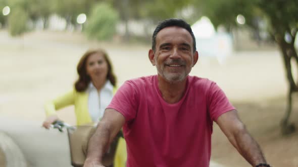 Front View of Happy Bearded Man Sitting on Bike