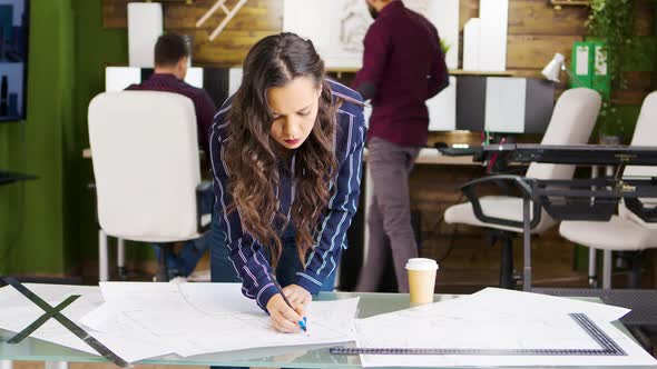 Female Architect in the Office Working Hard To Finish the Project for New Office Building