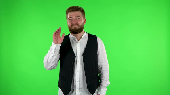 Man Waving Hand and Showing Gesture Come Here. Green Screen