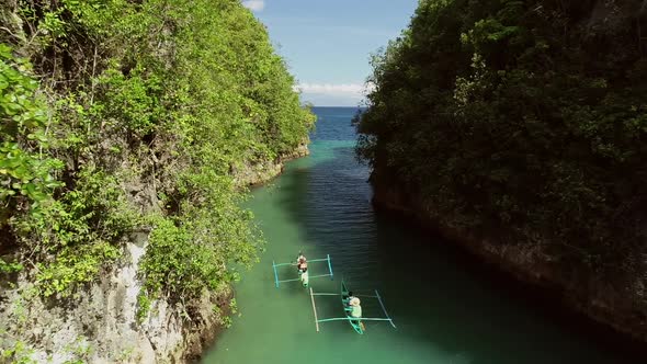 Aerial view of traditional fishing boats in Bojo River, Aloguinsan, Philippines.