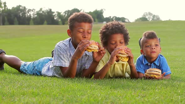 Three Boys Are Eating