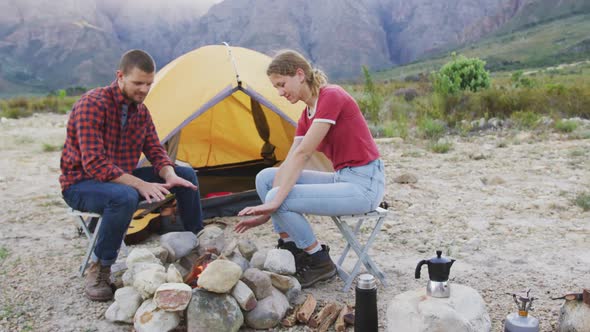 Caucasian couple camping in nature