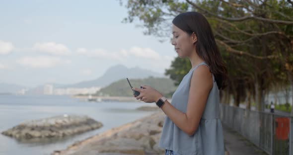 Woman Fly Drone and Stand at The Seaside