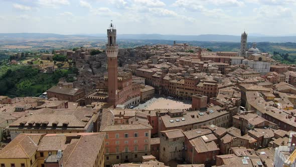 Flying over highlights of Siena - Piazza Del Campo and cathedral, Italy, Europe