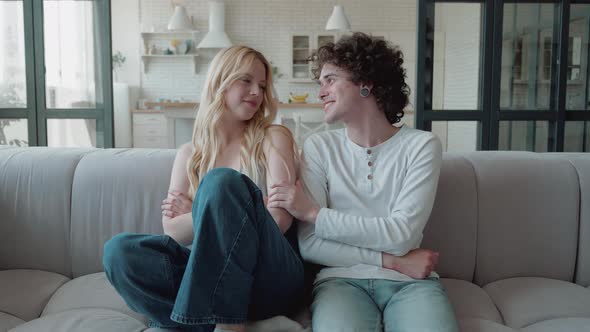 Side View of Caucasian Young Teens Couple Having Reconcile with Each Other and Hugging Reconciled