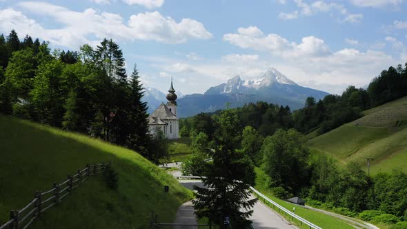 Aerial Fly Towards Church Maria Gern Mount Watzmann in Background Berchtesgaden Bavaria Germany