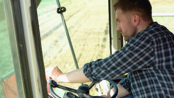 Farmerdriver on the Wheel of the Combine