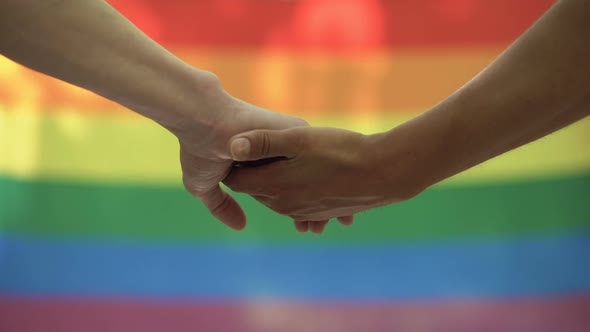 Gay Stroking Partner Hand Lgbt Flag Background, Rights Equality Pride March