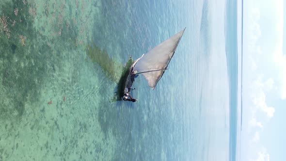 Vertical Video Boats in the Ocean Near the Coast of Zanzibar Tanzania Aerial View