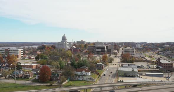 Jefferson City, Missouri skyline during the day with drone videoing down.