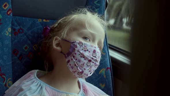 Four Years Old Girl in a Mask