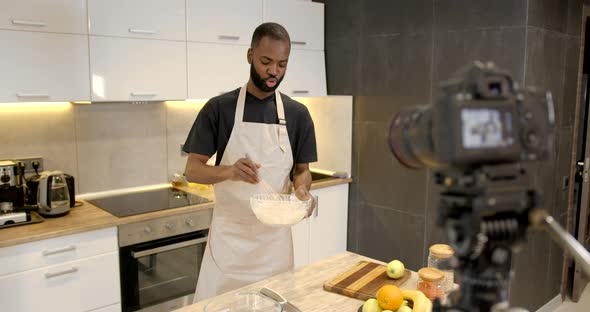 Handsome Man Filming Cooking Show or Blog