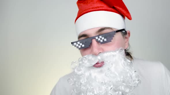 Dancing Swag Santa Claus in Funny Pixelated Sunglasses on White Background