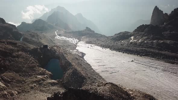 Drone aerial view, landscape. Rocky mountains, glacier, alpine lake. Cabane Orny, Switzerland