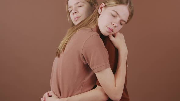 Twin Girls Embracing