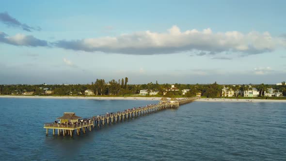 Naples Beach and Fishing Pier at Sunset, Florida.