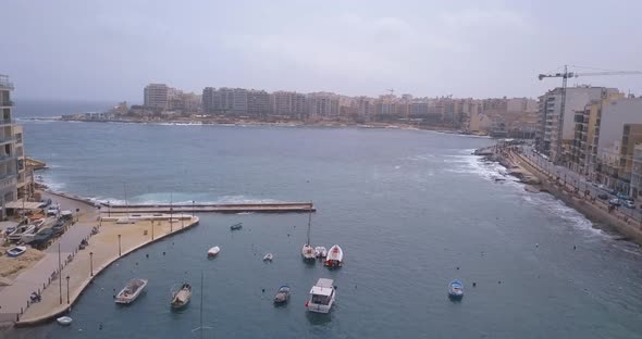 Spinola Bay with Traditional maltese Luzzu