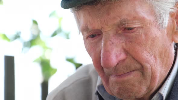 Portrait of a Crying Old Grandfather Looking Down He is Depressed and Sad