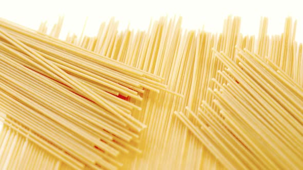 Raw spaghetti on white background