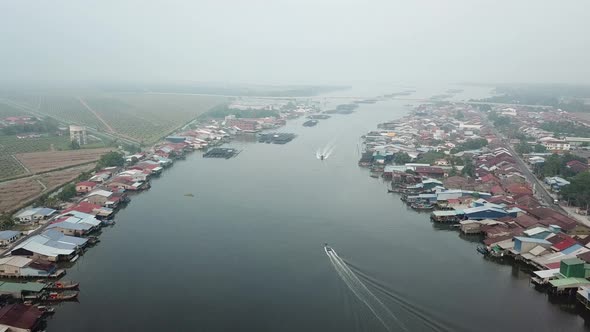 Tow boats move in different direction at Sungai Kurau near Kuala Kurau 