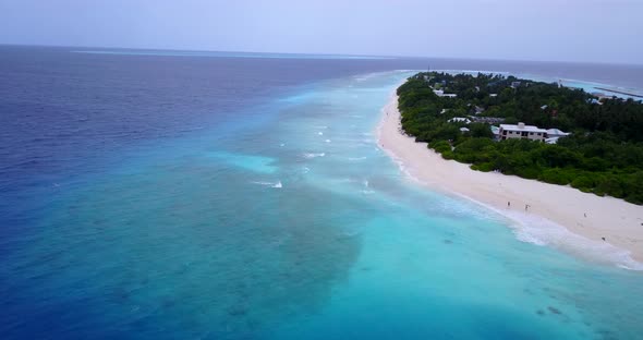 Natural birds eye island view of a white sand paradise beach and blue sea background